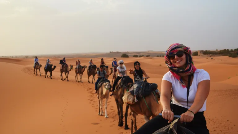 What are the must-visit attractions during a 4-day Marrakech to Merzouga tour?